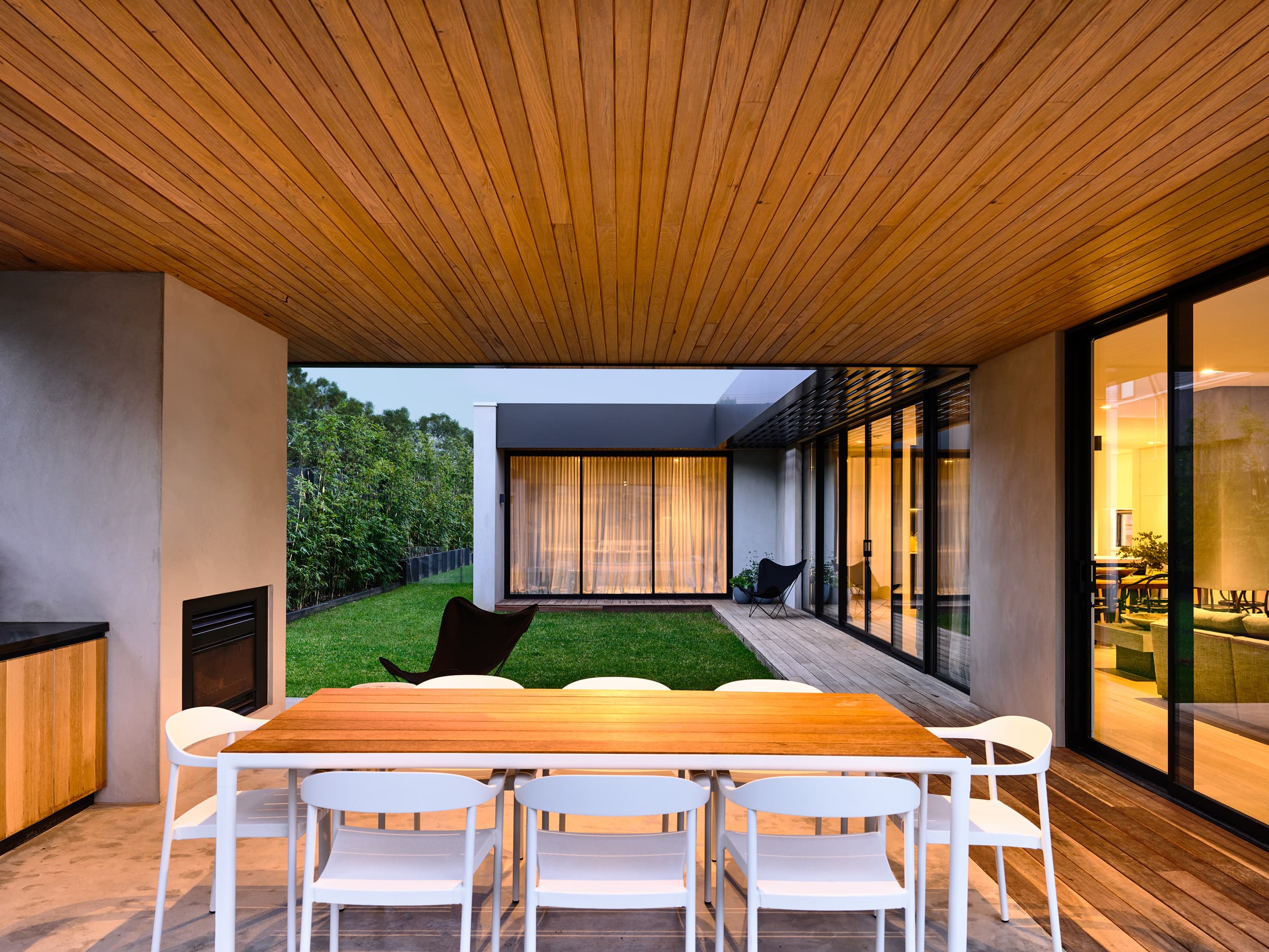 Rear elevation at dusk with pool